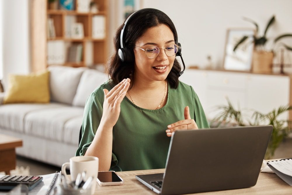 Woman working from home as a virtual receptionist for a legal team