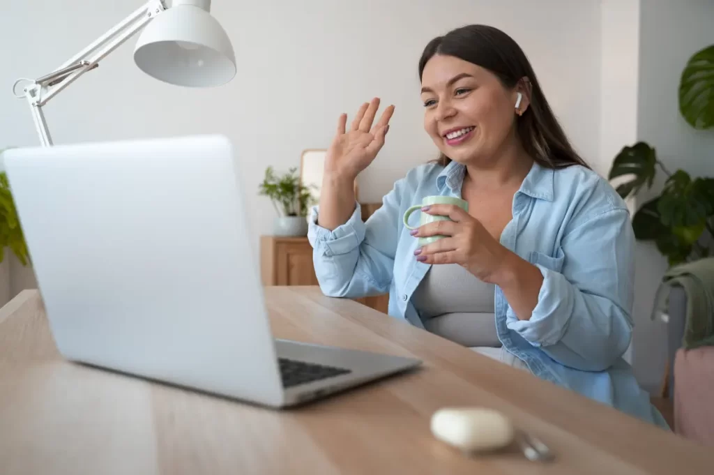 Woman working remotely on a laptop for outsourcing